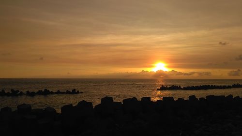 Scenic view of sea against sky during sunset