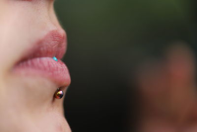 Close-up of woman with piercing in lip