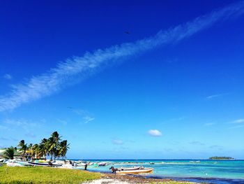 Scenic view of sea against blue sky