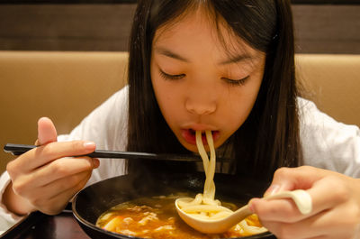 Portrait of woman eating ice cream