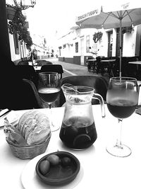 Close-up of wine glasses on table at cafe