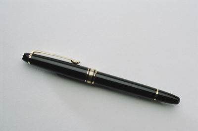 High angle view of pen on table against white background
