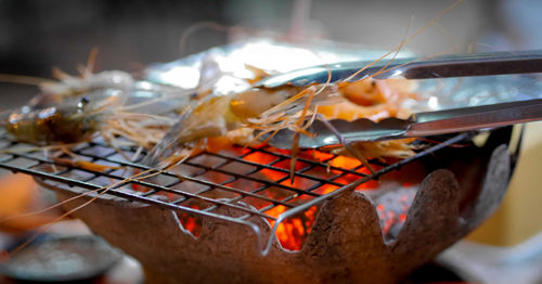 Close-up of meat on barbecue grill