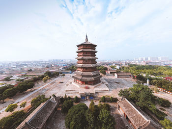 Panoramic view of buildings in city against sky