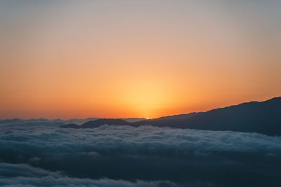 Scenic view of mountains against sky during sunset
