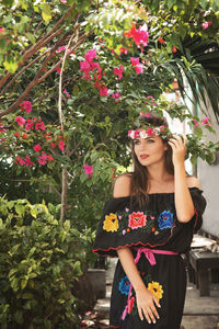 Young woman holding flowers