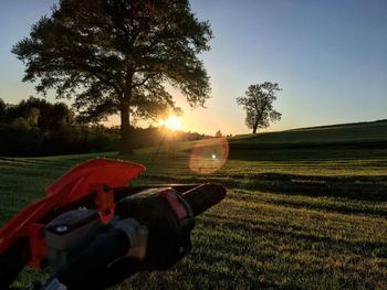 Scenic view of field against sky during sunset