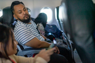 People sitting in an aeroplane.