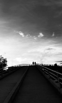View of bridge against cloudy sky