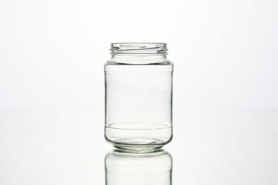 Close-up of glass of water against white background