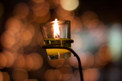 Close-up of illuminated tea light candle