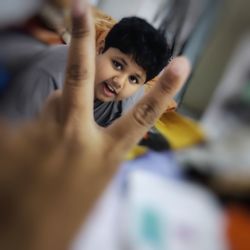 Portrait of smiling girl with arms raised