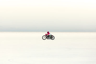 Man riding motorcycle at bonneville salt flats