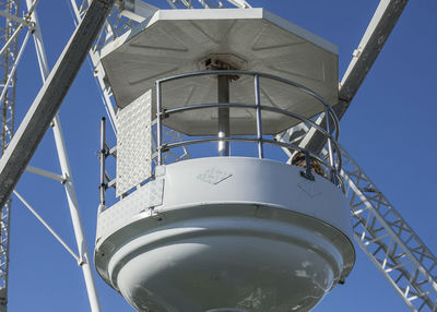 Low angle view of tower against clear blue sky