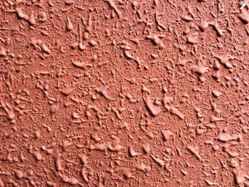 Close-up of clock on brick wall