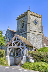 Low angle view of building against clear blue sky