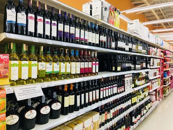 Row of bottles on display at store