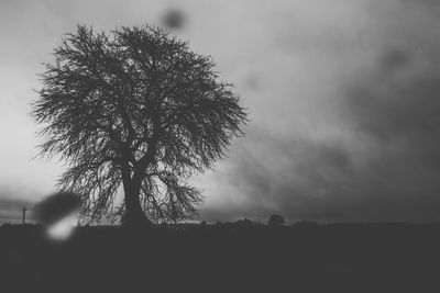 Scenic view of landscape against cloudy sky