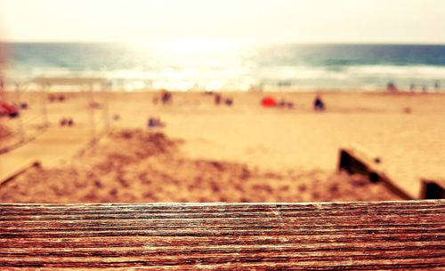 Close-up of sand at beach against sky