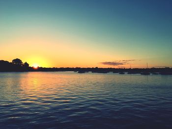 Scenic view of calm sea at sunset