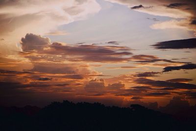 Scenic view of dramatic sky at sunset