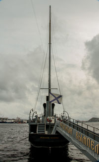 Sailboat sailing on sea against sky