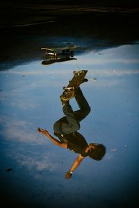 High angle view of man jumping in water