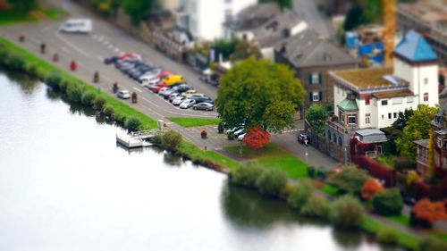 High angle view of town by river against sky