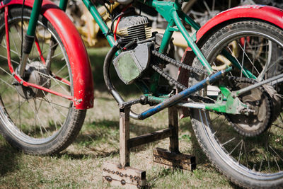 Close-up of bicycle parked on field