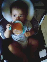 Portrait of boy drinking coffee