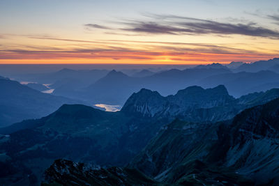 Scenic view of mountains against sky during sunset