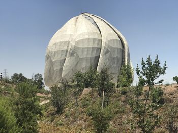 Built structure on landscape against clear sky