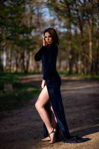 Portrait of beautiful young woman on land