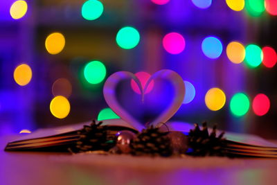 Close-up of multi colored heart shape on table