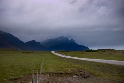 Scenic view of landscape and mountains against sky