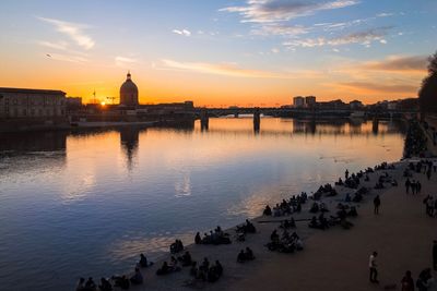 Scenic view of river against sky during sunset