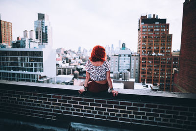 Woman looking at city