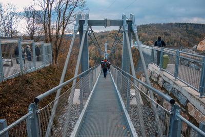 Footbridge over bridge against sky