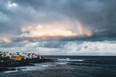 Rainbow over coast of tenerife, spain