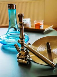 Close-up of hookah on table