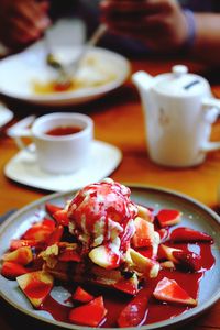 Close-up of breakfast served on table