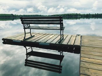 Pier on lake against sky