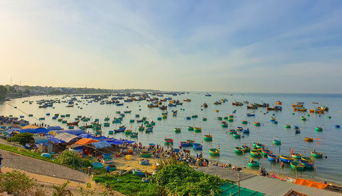 High angle view of crowd at beach against sky