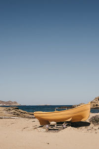 Scenic view of beach against clear sky