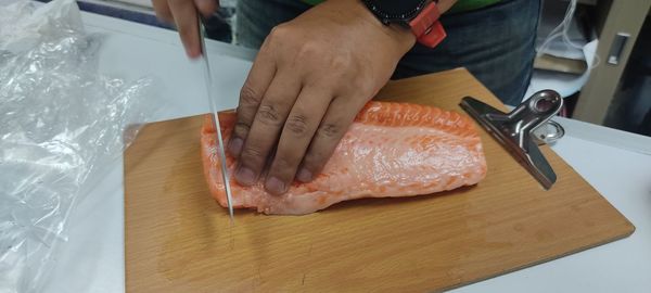 High angle view of person preparing food on cutting board