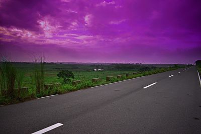 Country road against sky