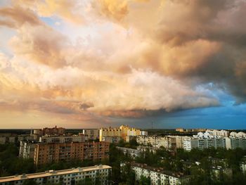 High angle view of buildings against sky during sunset