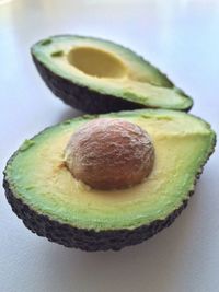 Close-up of sliced avocado against white background