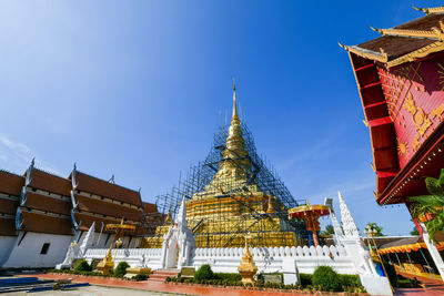 Low angle view of pagoda against buildings