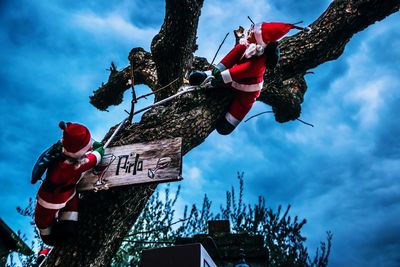 Low angle view of flags against sky